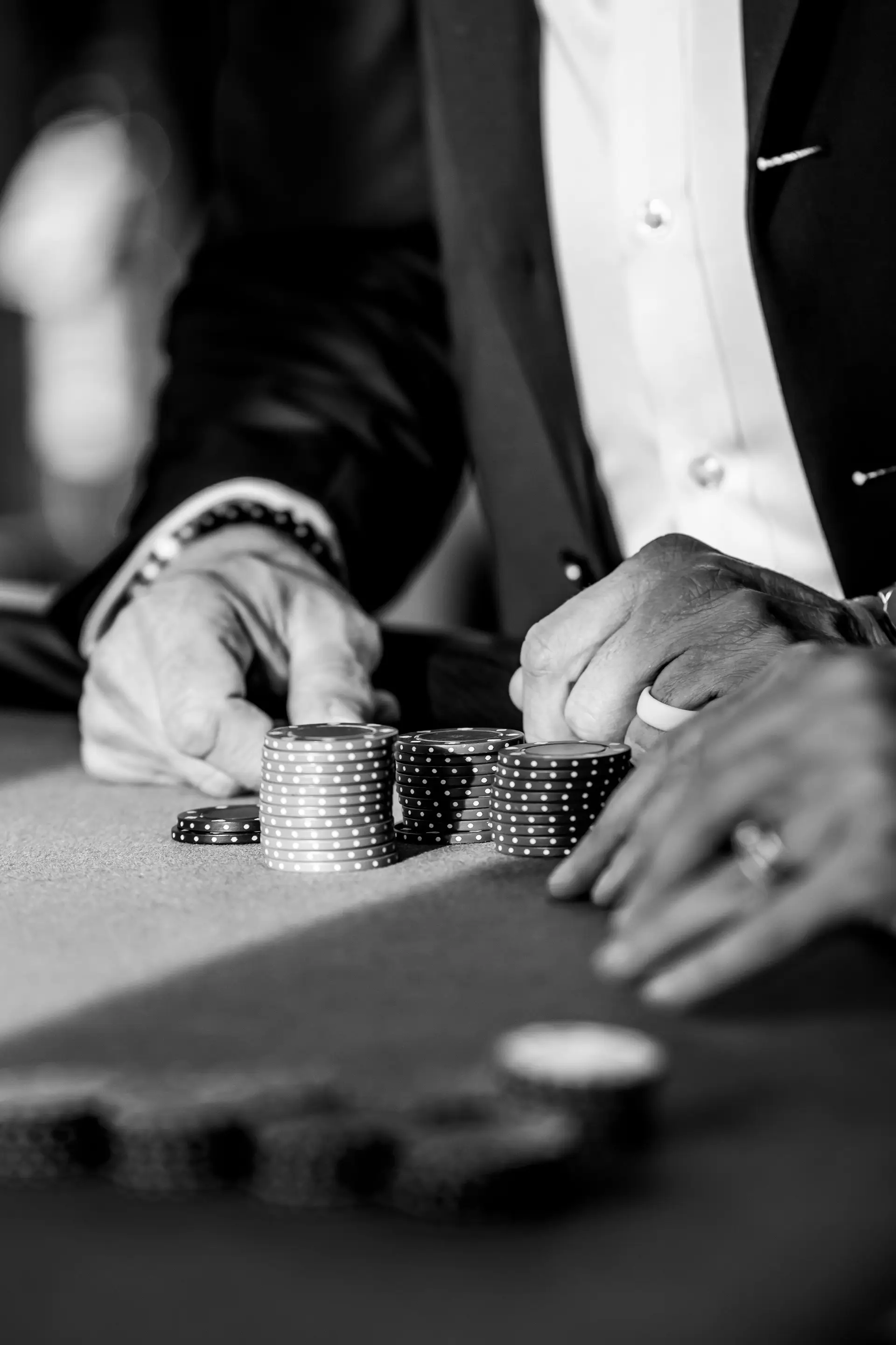 Stylish man playing poker at a casino table
