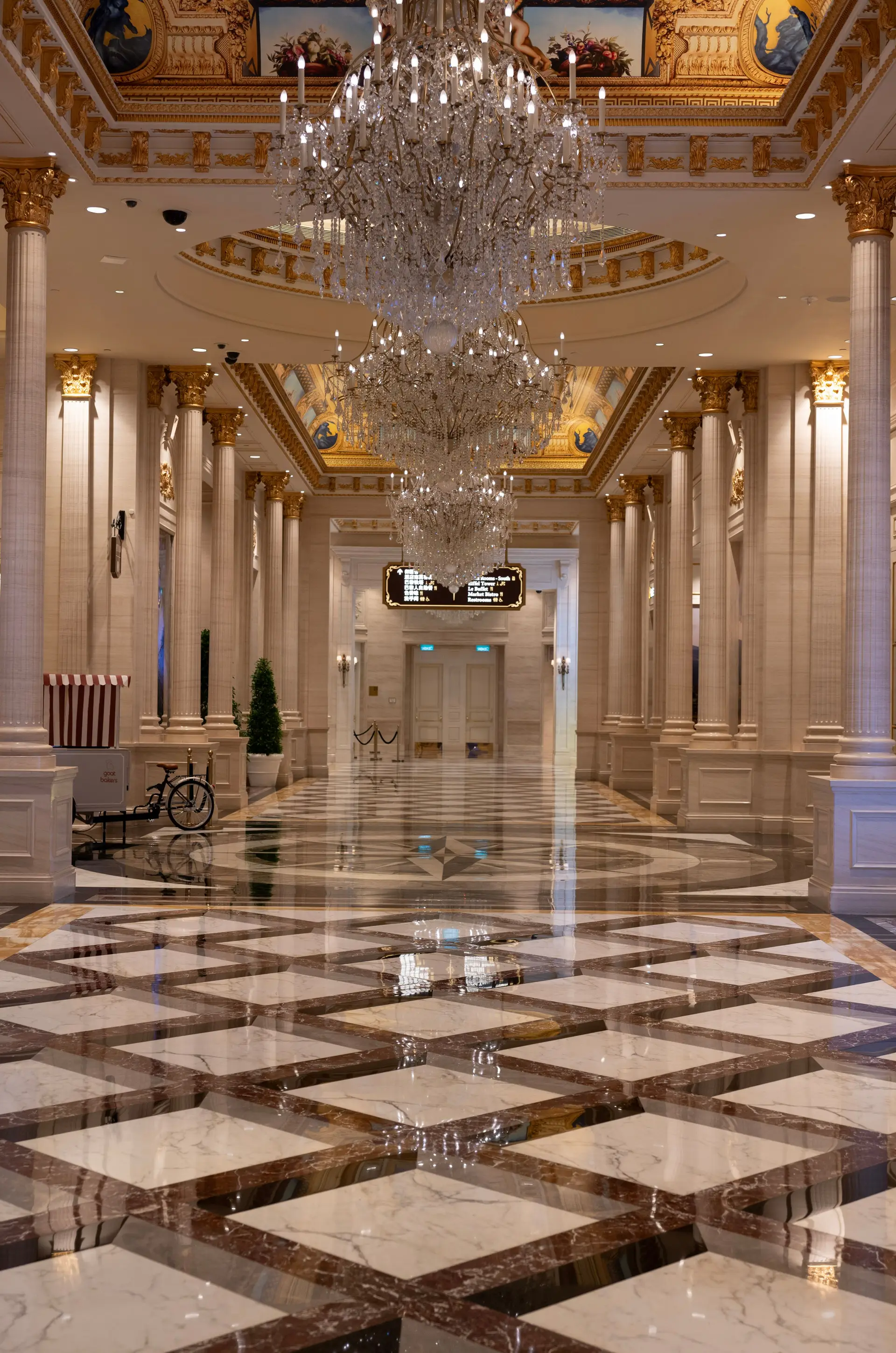 Elegant hall with chandeliers and marble flooring in a luxury casino resort
