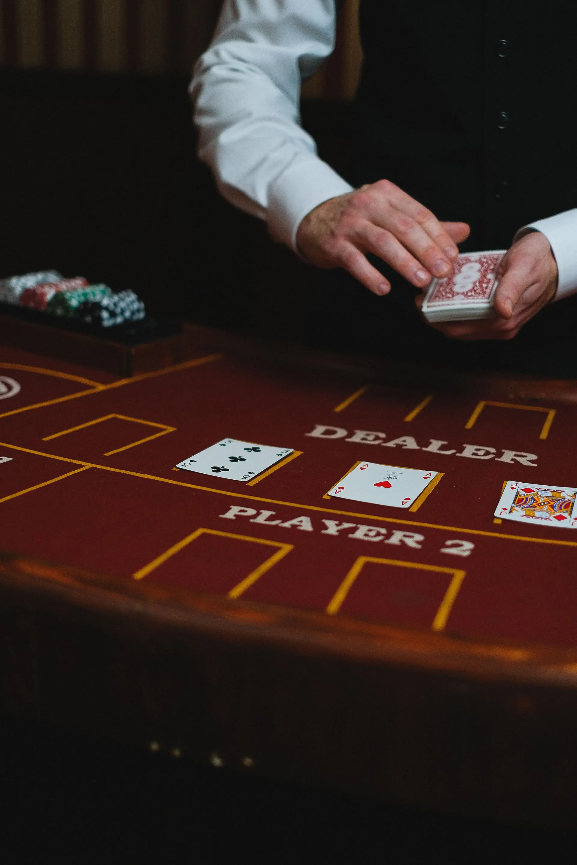 Dealer dealing cards on a gaming table