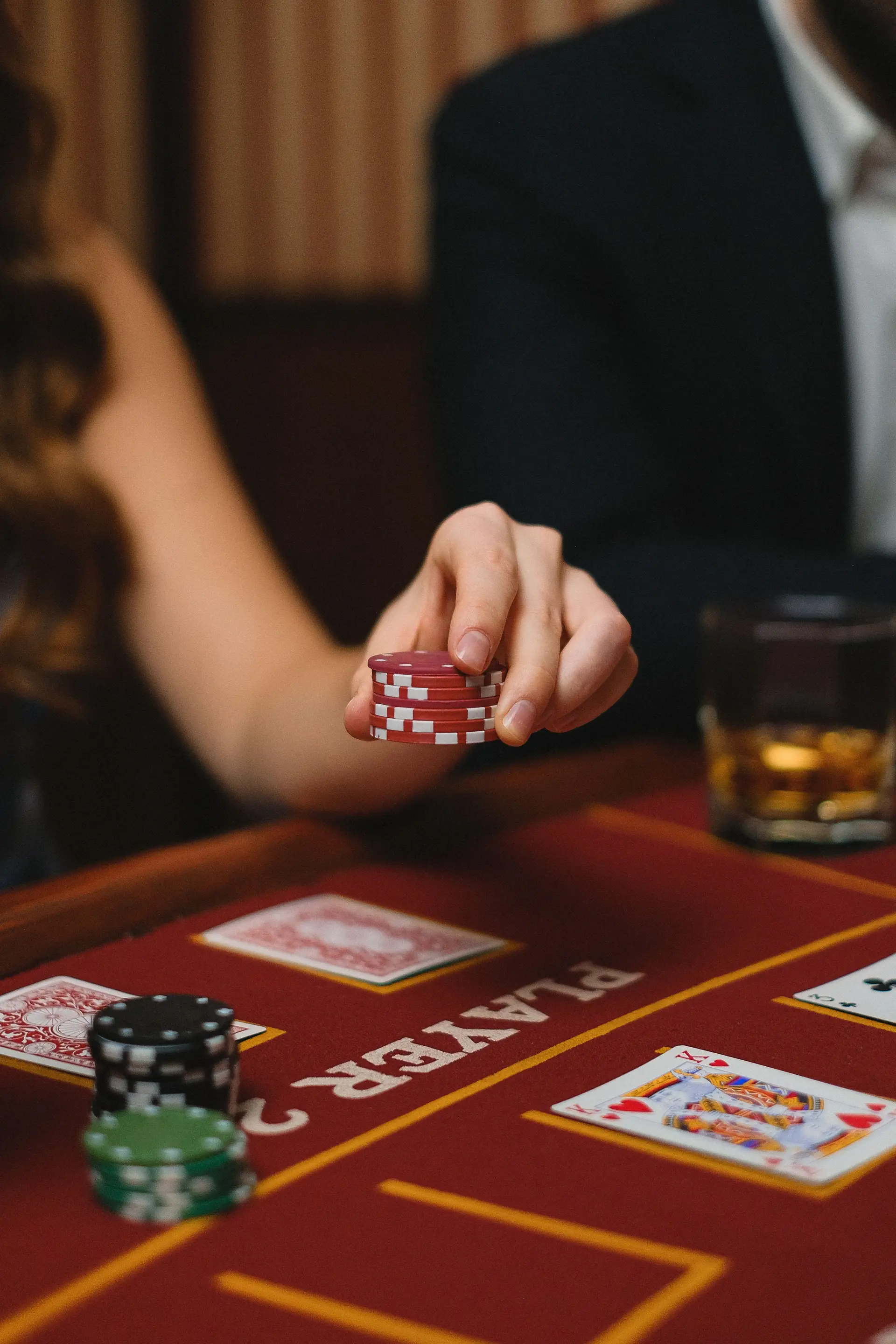 Close-up of poker chips and cards in a luxury setting